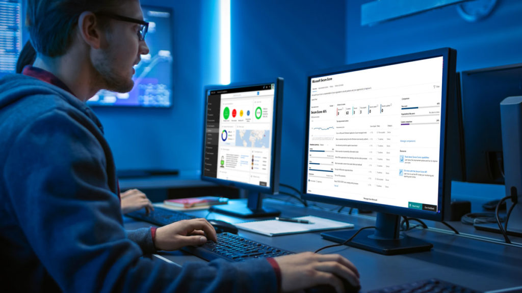 Man in his office looking at his computer screen