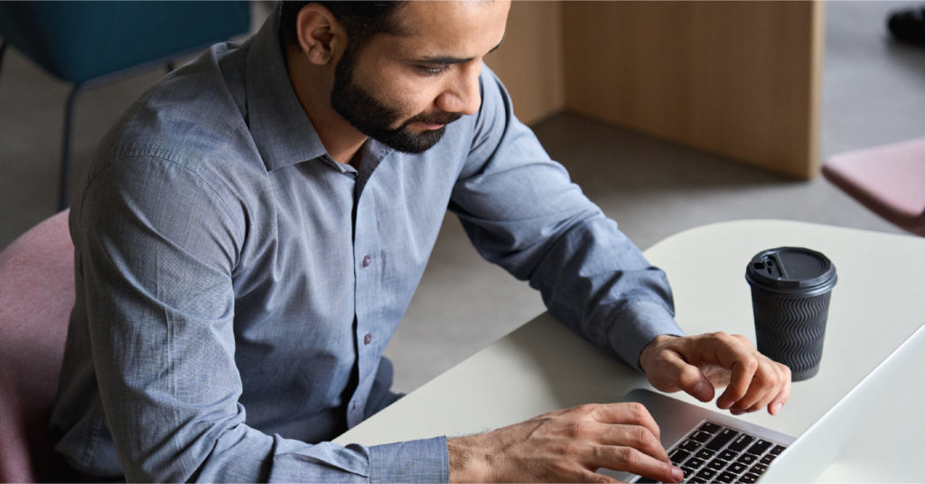 Business Person Researching Microsoft Dynamics Licensing on a Computer