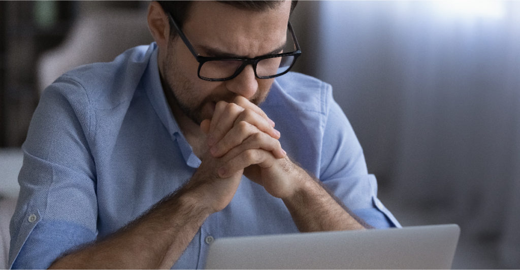 Businessman getting frustrated with software performance issues.