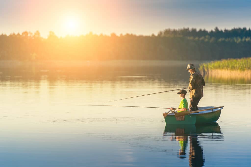 Father and Son fishing at sunset