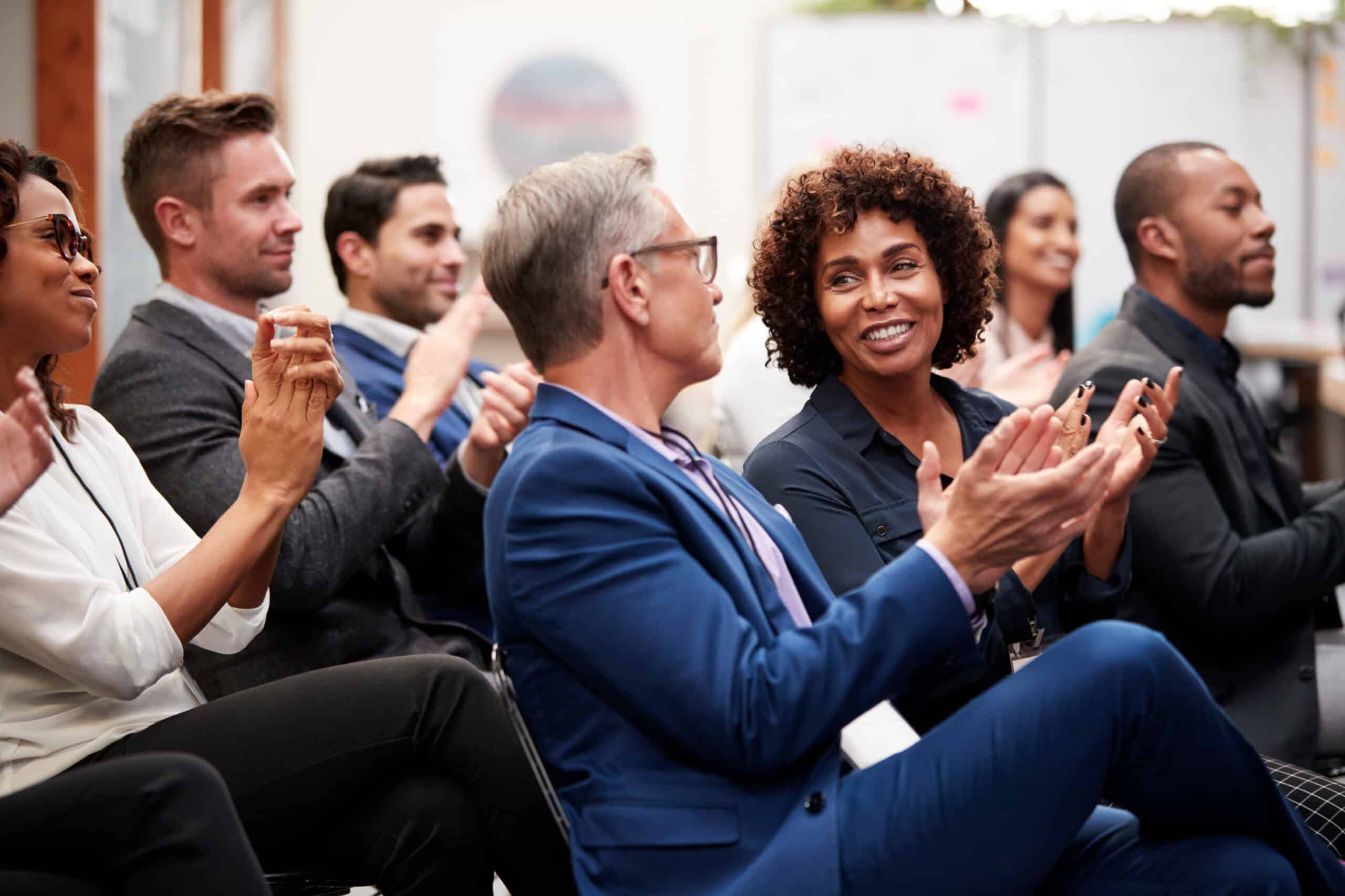 Business leaders communicating at a confrence